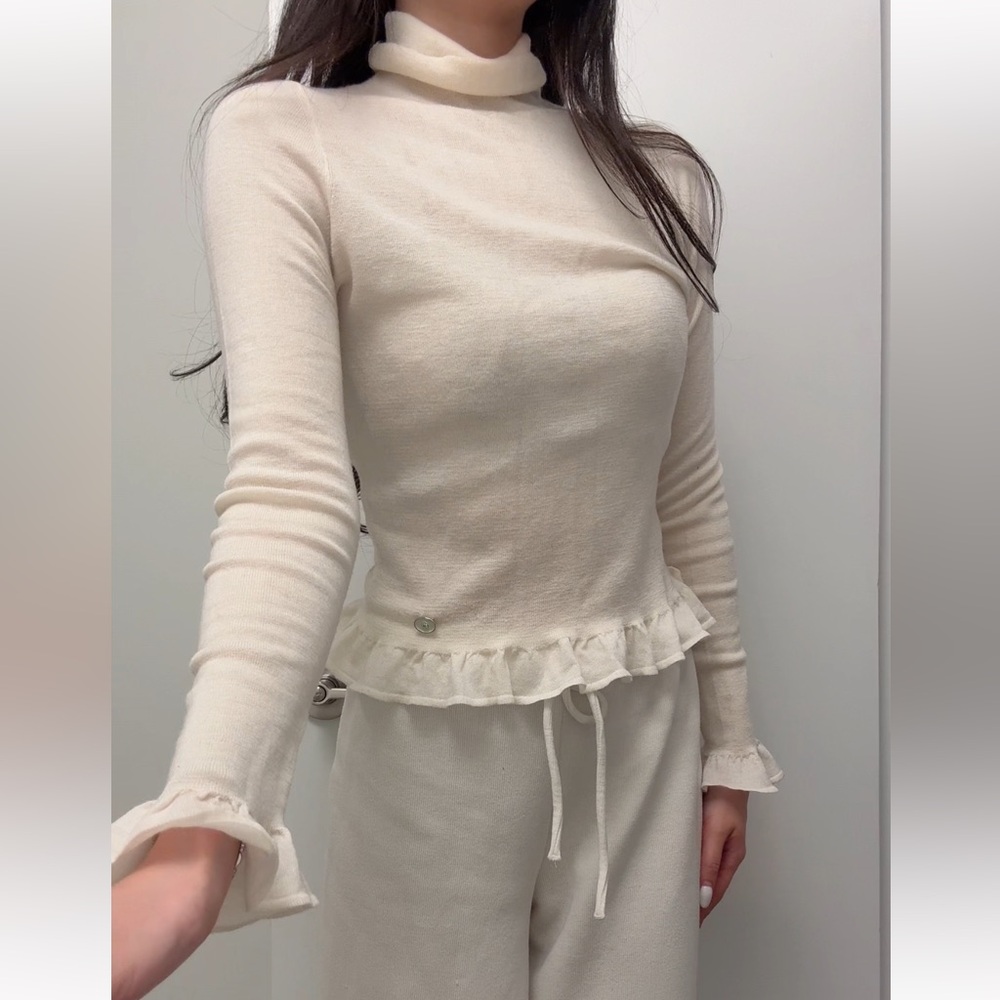 Cream Ruffle Hem Turtleneck Sweater